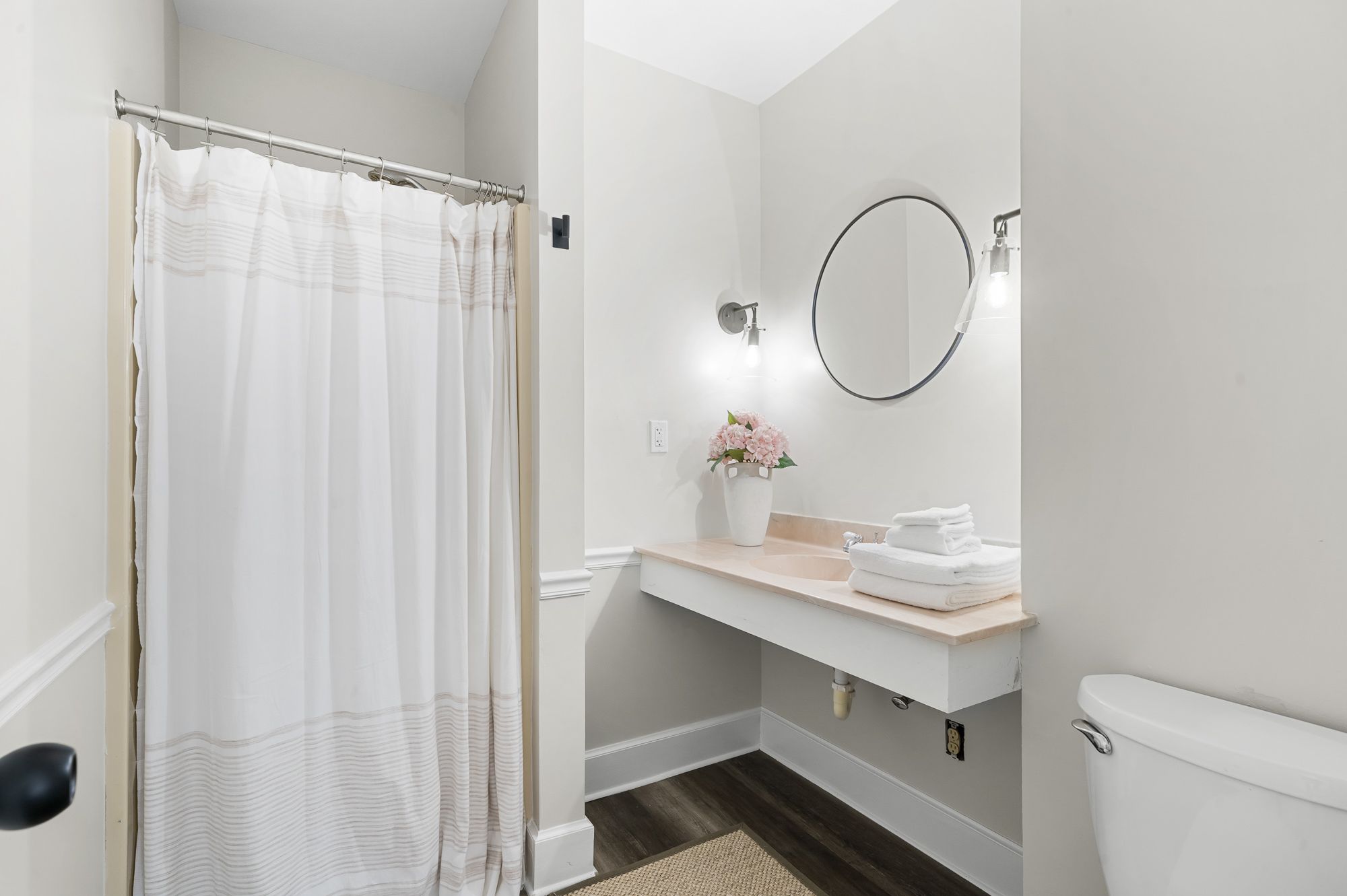 The Garden bathroom with a shower and floating vanity